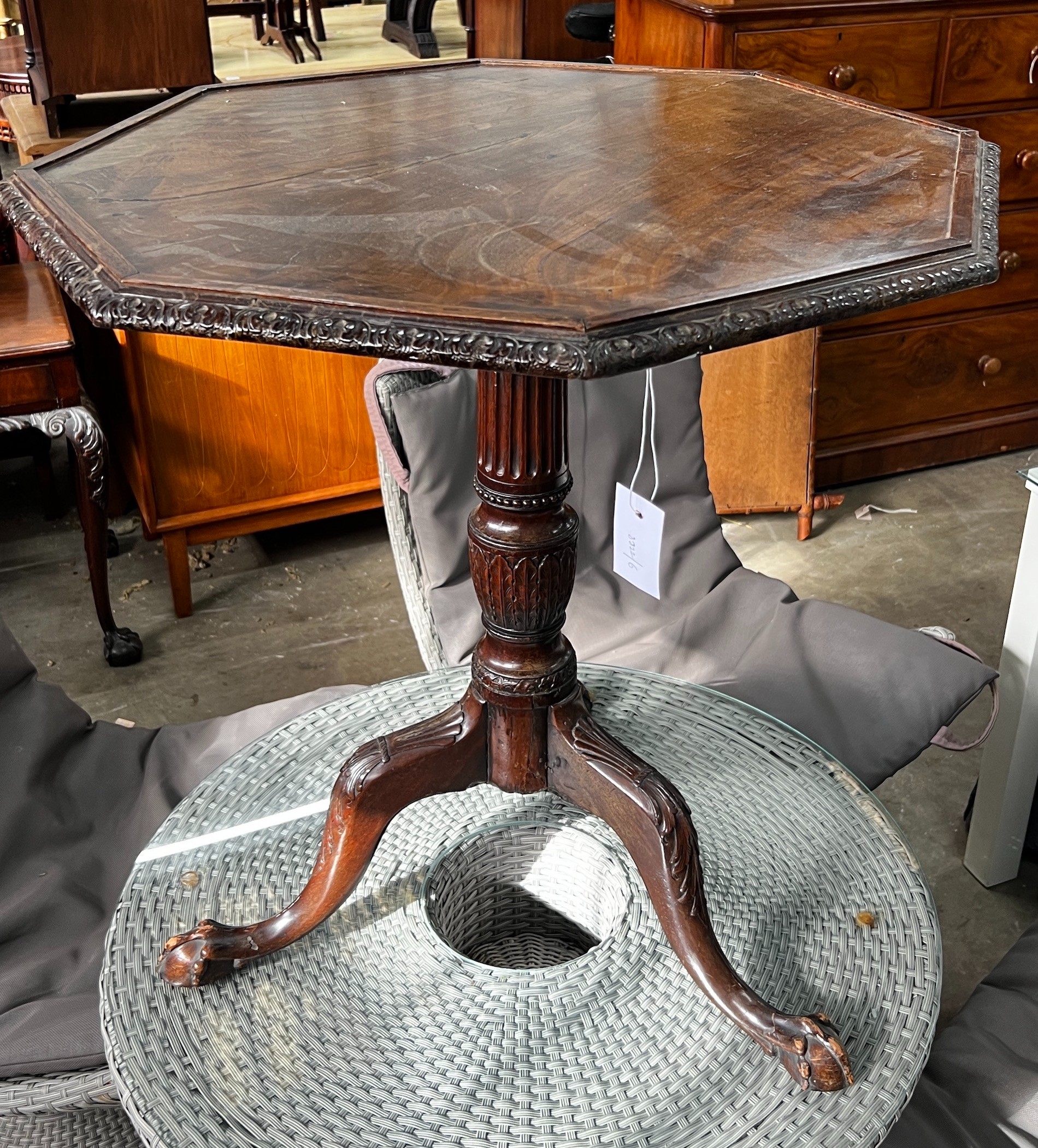 A George III and later octagonal mahogany tilt top tripod tea table, width 68cm, height 74cm